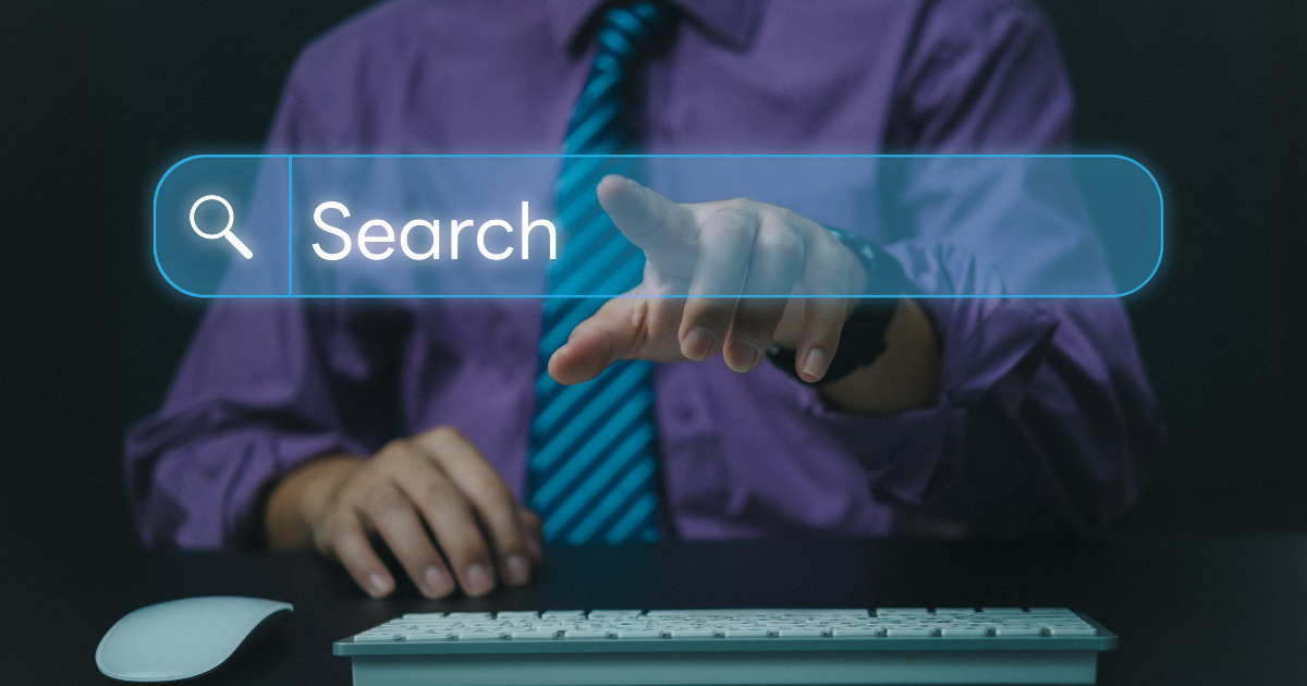 Person pressing a search bar